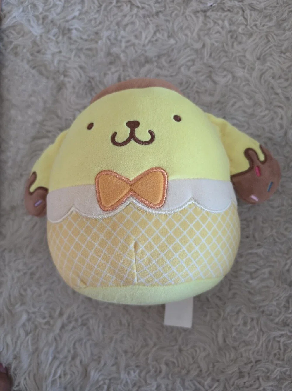 Squishmallows Yellow Puppy Plush with Orange Bow and Brown Ears